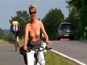 Experience The Exhilarating Sensation Of A Wild, Outdoor Bike Ride With A Seductive Blonde Goddess. Watch As She Flaunts Her Big Assets On The Beach, Leaving You Craving For More. Your Wildest Fantasies Await! Porn