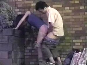 Watch This Amateur Straight Couple Get Down And Dirty In Public! Catch A Glimpse Of Their Doggy-style Quickie Behind A Building Caught On Camera. Porn